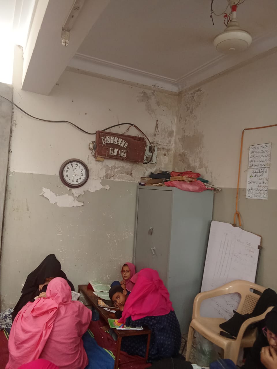 A small classroom showing limited furniture and facilities